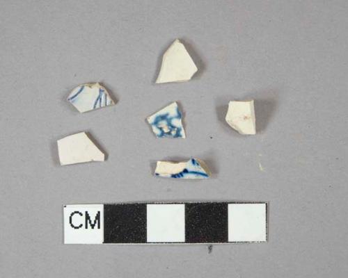 3 blue on white decorated pearlware fragments, 1 vessel rim fragment, 2 vessel body fragments, 1 undecorated creamware vessel body fragment, 2 white salt-glazed stoneware vessel body fragments, 1 with scratch-blue decoration