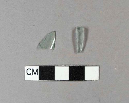 Aqua bottle glass fragments, one is embossed