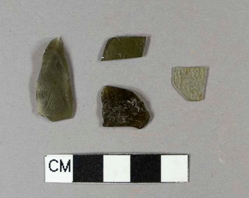 Olive green bottle glass fragments, one with textured surface