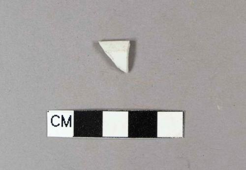 Undecorated porcelain rim sherd, with rough, unglazed band along the rim