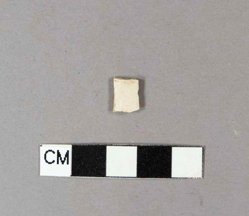 Smoked pipe bowl fragment with possible incised or rouletted line around rim