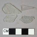 colorless flat glass fragments, 1 colorless vessel body fragment