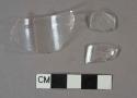 Colorless glass vessel rim and body fragments, possible stemware or jar, ~4.6cm diameter