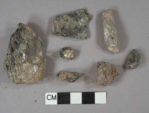 5 burned coal fragments, 2 slag fragments