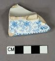 Blue on white transfer decorated earthenware vessel base fragment, white paste, possible footring of tureen