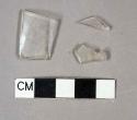 Colorless glass vessel body and rim fragments, possible stemware