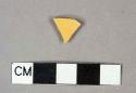 Yellow lead glazed earthenware vessel body fragment, buff paste, undecorated