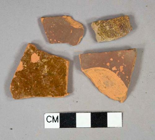 Redware vessel body fragments, 2 lead glazed fragments, 2 dark brown painted fragments, undecorated
