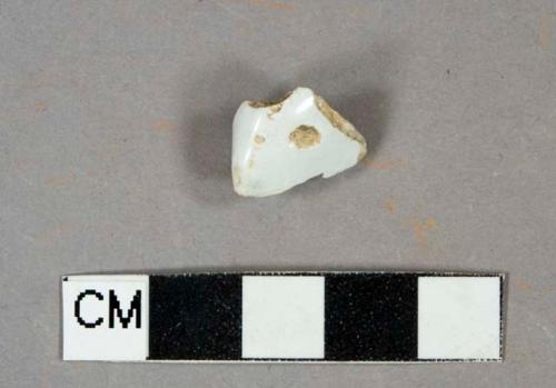 White lead glazed earthenware, likely pearlware, possible rim or foot ring fragment, undecorated