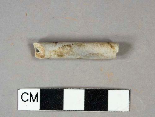 Kaolin pipe stem fragment, burned, undecorated, 4/64" bore diameter