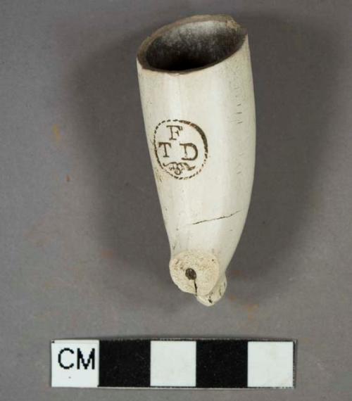 Pipe, white kaolin, bowl; maker stamp on surface of "TFD" in cartouch, indistinct molding on foot, burned interior, possible maker Thomas Dennis, Bristol, Freeman