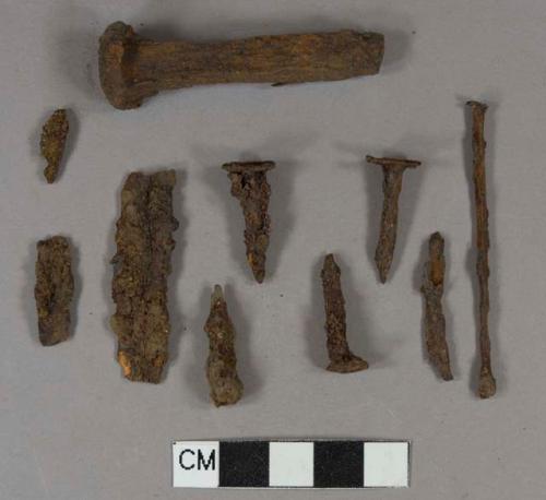 Iron nail fragments, some cut or wrought, some wire; one may be a stake