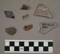 3 fragments glass; 1 fragment glazed pottery; 1 fragment unglazed pottery; 2 sto