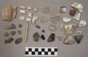 11 bones & fragments); 2 coal; 5 brick & stone fragments; 24 chipping waste; 8 g