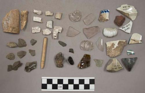 11 bones & fragments); 2 coal; 5 brick & stone fragments; 24 chipping waste; 8 g