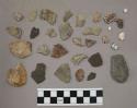 14 pieces quartz; 1 piece glass; 7 bone fragments; 1 piece chalk-like material;
