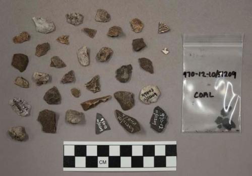 14 fragments quartz and limestone; 2 chips pottery?; 40 chips stone; 3 fragments