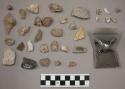 1 piece glass; approx. 13 bone fragments (some chalk-like in texture); 86 stone