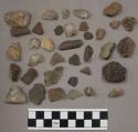 19 quartz pieces; 40 stone chips; 10 pieces unglazed pottery