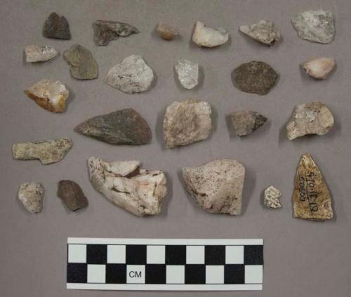63 stone pieces; 74 pieces quartz; 1 framgent bone