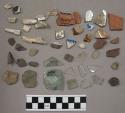 Bone, chipping waste, pottery, iron, charcoal, glass, pottery sherd, biface frag