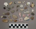 9 pieces quartz; 19 stone chips; 13 frags glazed pottery; 4 pcs glass; 1 fragmen