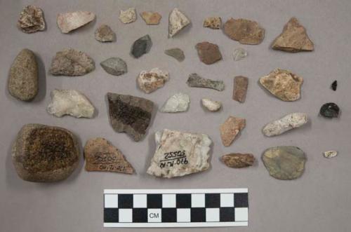 45 quartz pieces; 77 stone chips & pieces; 1 piece coal (?) ; 1 small bone fragm