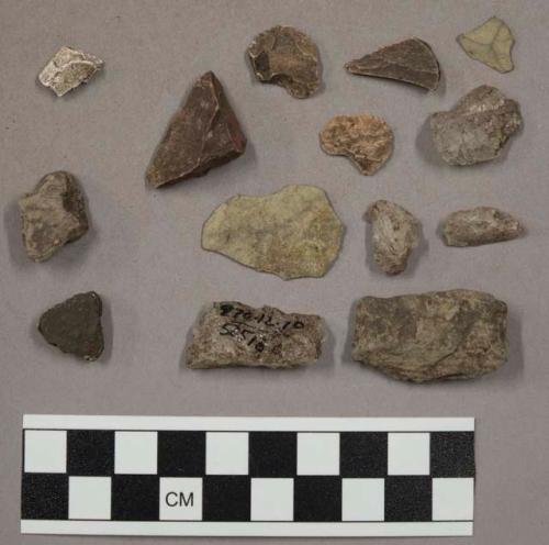 21 stone chips; 13 pieces quartz; 3 pcs unglazed pottery; fragment bone