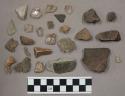 Fragment bone; 6 pieces unglazed pottery; piece hard, flinty stone; 69 stone pcs