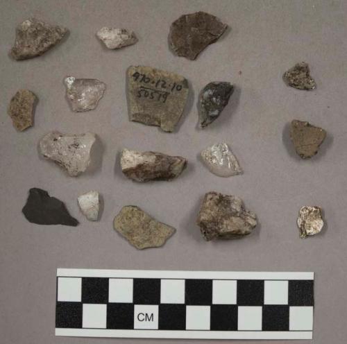 23 quartz pieces; 48 stone pieces; 3 pieces unglazed pottery; fragment bone