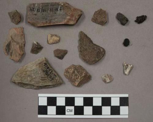 31 quartz pieces; 2 pieces coal (?); 1 bit charcoal; 1 bone fragment; 3 pcs hard