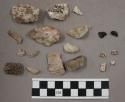 21 quartz pieces; 7 stone chips & pieces; 4 bone frags; 2 charcoal