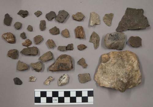 Pottery sherds, ground stone, quartz chipping waste