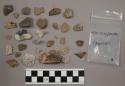 50 quartz pieces; 150 (approx) stone pieces (1 artifact); 34 bone fragments; 52