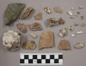 40 fragments bone; 7 bits charcoal; 164 stone pieces and chips; 19 quartz pieces