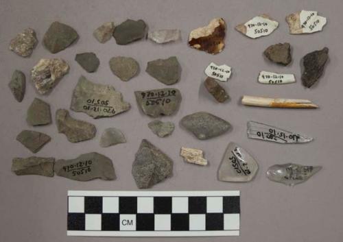 2 glass, 1 glass fragment, 1 pipe stem fragment, 5 pottery, pottery sherds, 1 bo