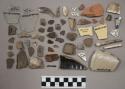 15 glass and fragments, 19 pottery, 2 pipe fragments, 1 poor quality stoneware,