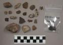 14 pieces quartz; fragment bone; 3 bits charcoal; 50 (approx.) stone flakes and