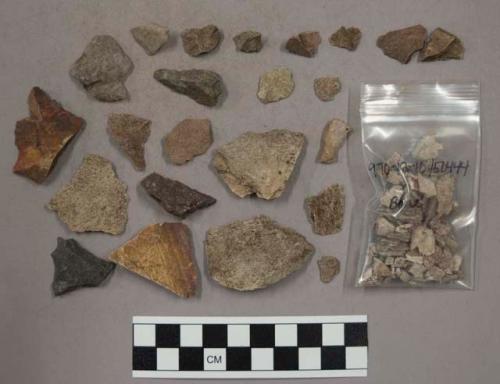 23 pieces quartz; 15 larger stone pieces possibly 3 artifacts; 85 stone chips; a