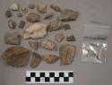 60 quartz pieces; 13 stone pieces (2 possible artifacts); approx. 110 stone chip