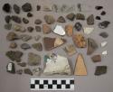 Pottery sherds (1 rim sherd 50902?), 7 glass and fragments, 15 pottery and fragm