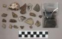 2 pieces bone (?), 58 stone pieces and chips; 25 quartz pieces; bag of charcoal