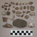 8 large stone pieces; 1 bone (?) fragment; 32 pieces quartz; 154 small stone chi