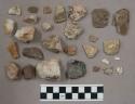 52 quartz pieces; 20 stone pieces; 4 bone fragments; 2 worked stone pieces; 1 cy