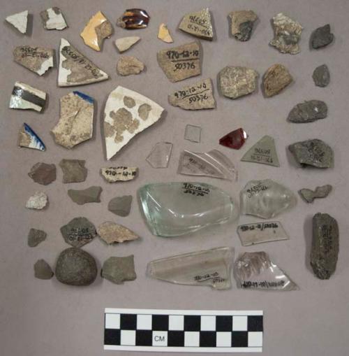 Stone chips, glass, potsherds, historic pottery