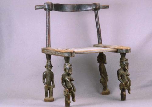 Chief's chair supported by figures