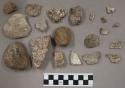 7 bone fragments; 8 unbroken pebbles; 34 chips quartz and limestone; (a) 2 chips