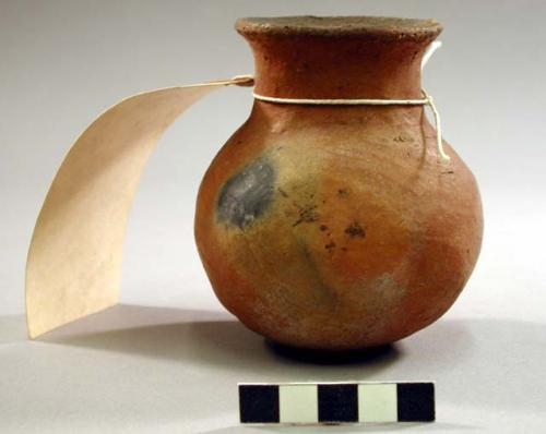 Red pottery dish, unglazed. 4" (height).