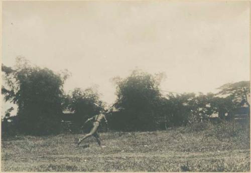 Igorot warrior throwing spear