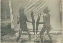 Igorot warriors posed fencing
